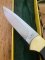 Puma Knife: Puma Original 1992 4 Star Fixed Blade Knife with Black Ebony Handle in Original Green and Yellow Box #26291