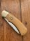 Puma Knife: Puma Original 1985 4 Star Folding Lock Blade Knife with Orange Ivory Micarta Handle