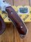 Buck Knife: 2008 Buck Gut Hook Alpha Hunter Folding Knife with Rosewood Laminated Handle & Pouch