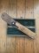 Puma Knife: Puma Original 1980's-90's 4 Star Fixed Blade Knife with Black Micarta Handle-Tan Sheath in Original Wooden Box