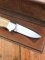 Puma Knife: Puma 1987 Original Scrimshawed 4 Star Folding Lock Blade Knife with Cape buffalo in Presentation Box