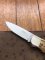 Puma Knife: Puma 1987 Original Scrimshawed 4 Star Folding Lock Blade Knife with Cape buffalo in Presentation Box