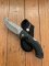 Buck Knife: 2007 Model 398 Large Buck OMNI Hunter Folding Gut Hook Knife with Black Handle & Pouch