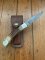 Buck Knife: 1989 Model Buck 110 Classic with Aged Stag Handle and Damascus Blade and Leather Pouch