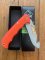 Puma Knife: Puma IP Pathfinder with gut hook, Orange Micarta Handle