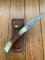 Buck Knife: 1989 Model Buck 110 Classic with Aged Stag Handle and Damascus Blade and Leather Pouch