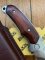 Buck Knife: 2008 Buck Gut Hook Alpha Hunter Folding Knife with Rosewood Laminated Handle & Pouch