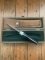 Puma Knife: Puma Original 1980's-90's 4 Star Fixed Blade Knife with Black Micarta Handle-Tan Sheath in Original Wooden Box