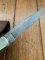 Buck Knife: 1989 Model Buck 110 Classic with Aged Stag Handle and Damascus Blade and Leather Pouch