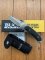 Buck Knife: 2006 Model Buck Alpha Hunter Folding Knife with Black Rubberised Handle & Pouch