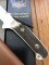 Puma Knife: Puma Rare Original 2001 Dark Stag New Hunter Model 118375 in original sheath and box.