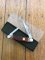 Puma Knife: Puma Bantam Folding Knife with Red Bone Handle Circa early 1990's
