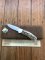 Puma Knife: Puma 1987 Original Scrimshawed 4 Star Folding Lock Blade Knife with Cape buffalo in Presentation Box